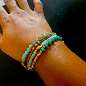 Turquoise and hammered gold bracelet with adjustable wrist joint.